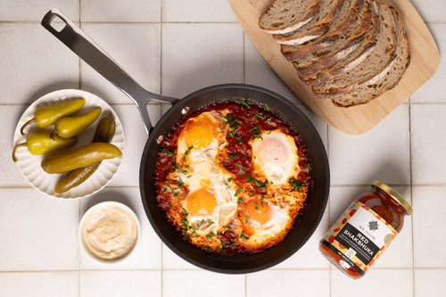 red shakshuka served with eggs
